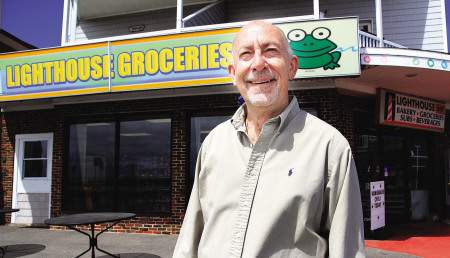 Bill Lally in front of Lighthouse Groceries