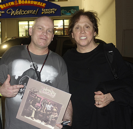 Rock enthusiast Buck Clow, of Gilford (left), met Doobie Brothers guitarist/singer John McFee in the Casino parking lot