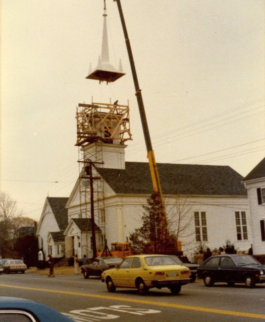 The new church steeple going on, April 2, 1980