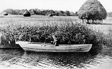 Man in boat in the marsh