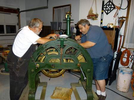 Cliff Pratt and Harvey Webber working on the town clock