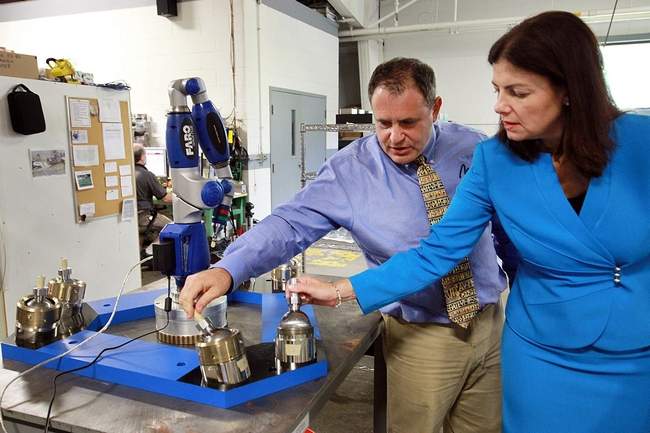 U.S. Sen. Kelly Ayotte, R-N.H., tours Mikrolar, a high-tech hexapod robot company in Hampton with company president Michael Fortier