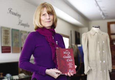 Cheryl Lassiter holding her new book on Goody Cole