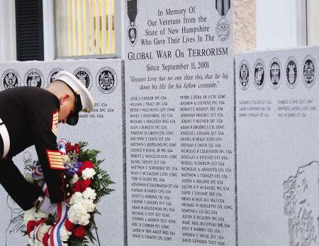 Master Sgt. William Paulino, USMC, places a wreath at a monument dedicated to New Hampshire soldiers who lost their lives in the Global War on Terrorism. Five more names were added this year. Ioanna Raptis